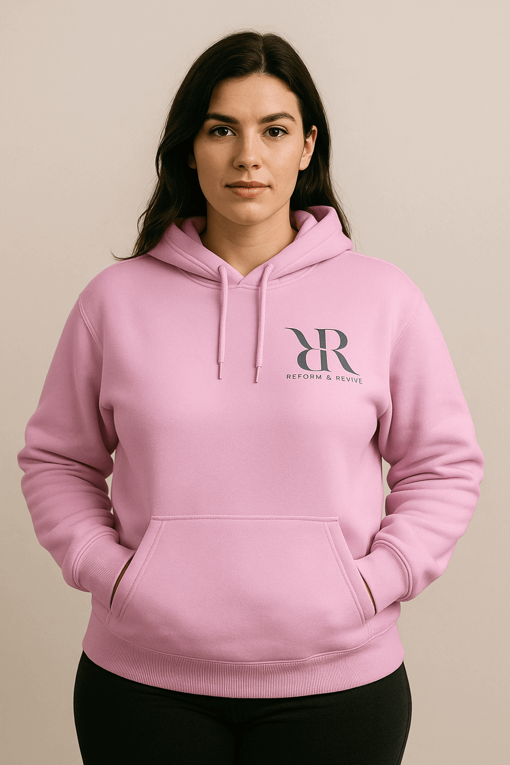 Model wearing a pink hoodie from the Reform and Revive Premium Yoga Set, showcasing comfort and style.