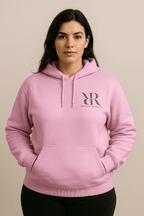 Model wearing a pink hoodie from the Reform and Revive Premium Yoga Set, showcasing comfort and style.